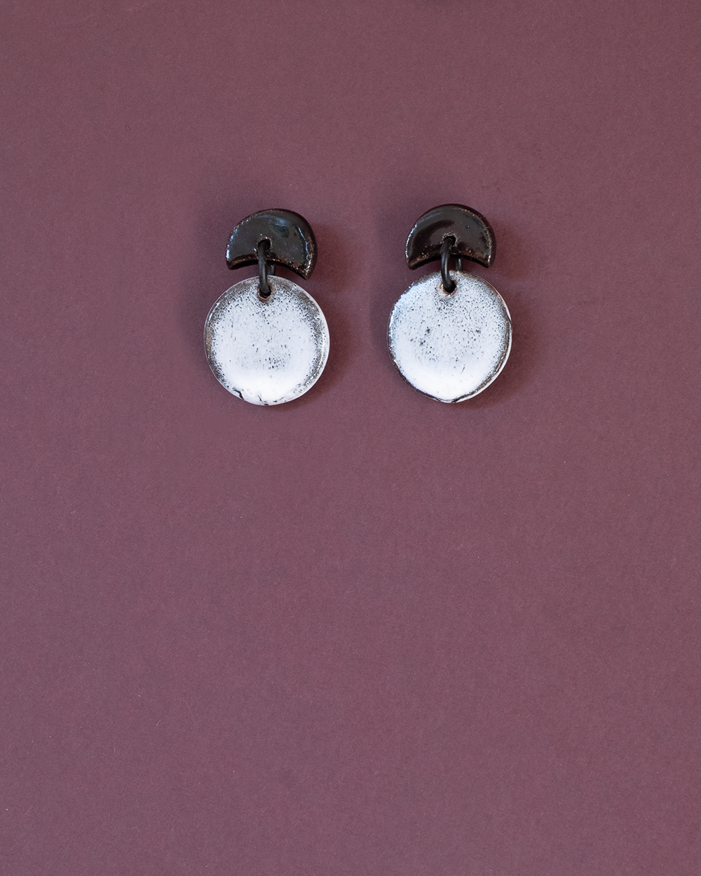 Eclipse earrings, black and white glaze.